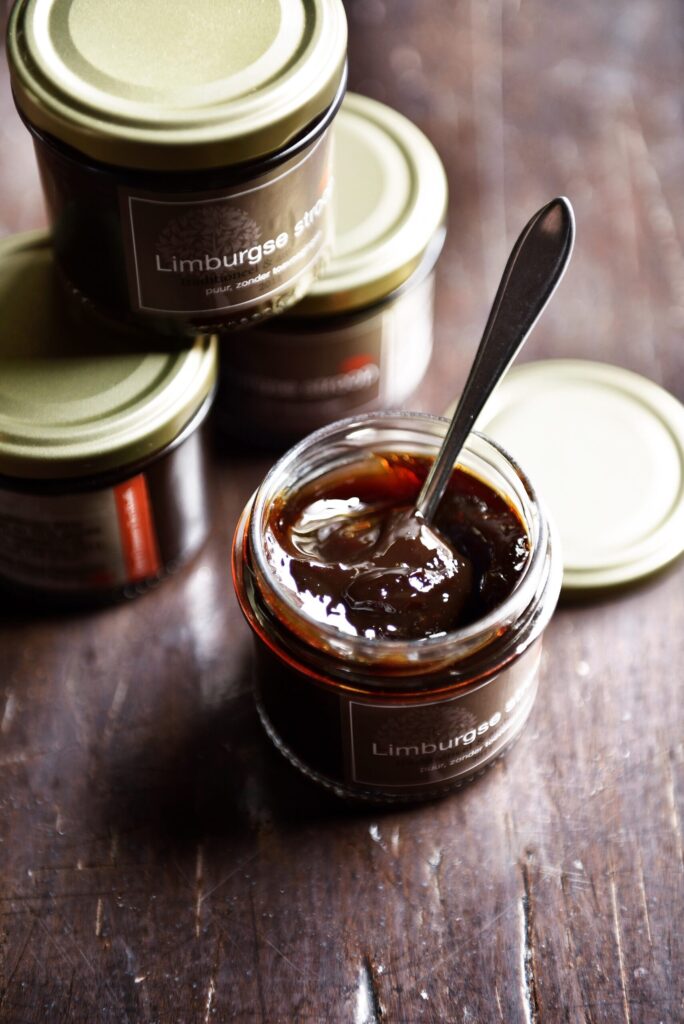 apple pear jam inside jar with spoon