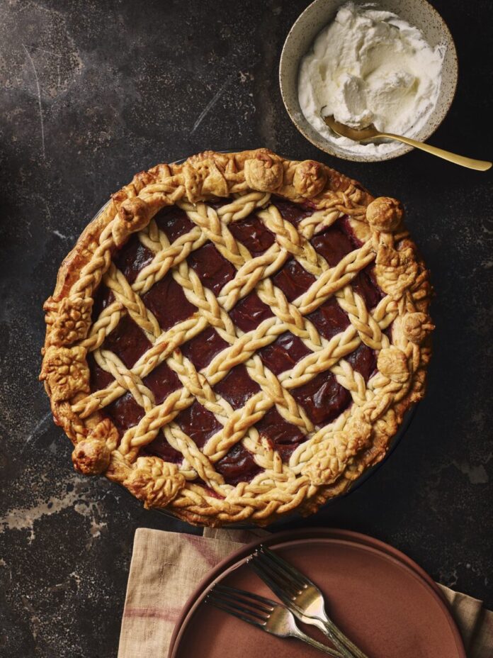 A pie with purple potatoes and bourbon honey with lattice work over top.