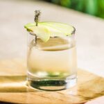 ALOE & APPLE WHITE NO-GRONI greenery in the background