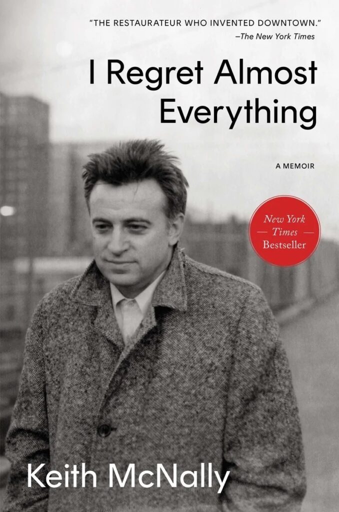 A man in black and white in a fashion jacket.