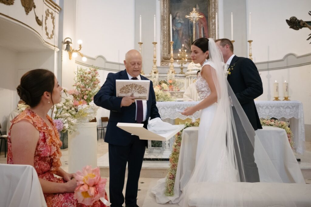 Bride Cristina Bartolacci and groom Philip Caputo during their wedding ceremony at Parrocchia di San Cipriano in Colonnella, Italy.