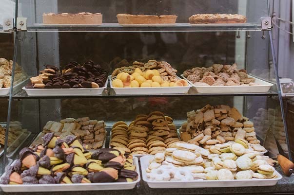 A case full of pastries and other sweets.