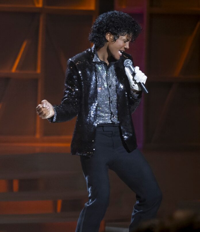 Michael Jackson in the Michael movie performing on stage.