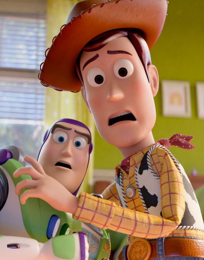 Woody and Buzz from toy Story huddle together in fear.