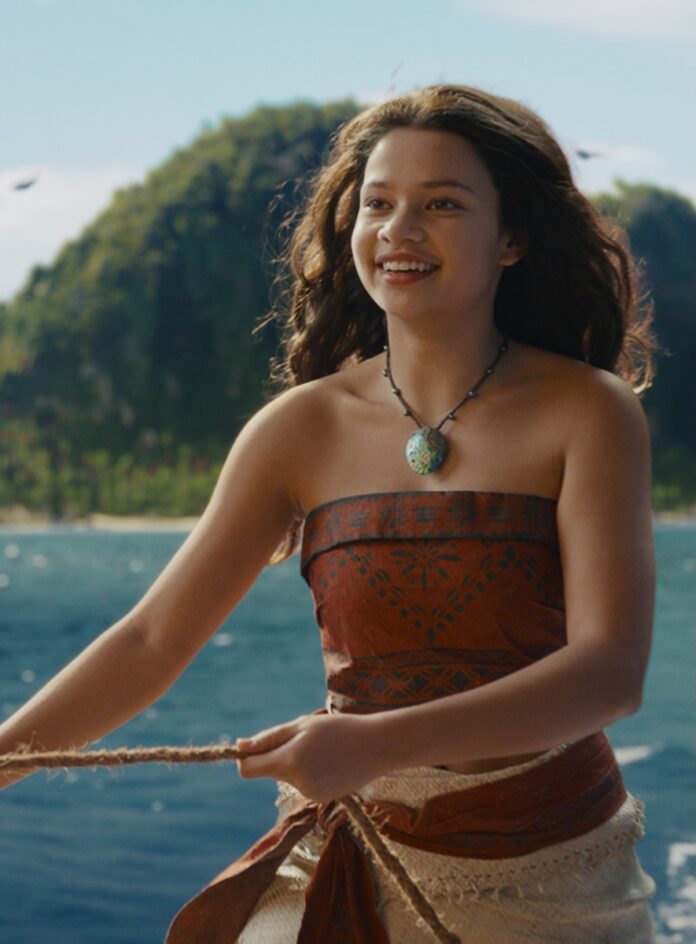 Moana in the live action movie on a boat in the ocean.